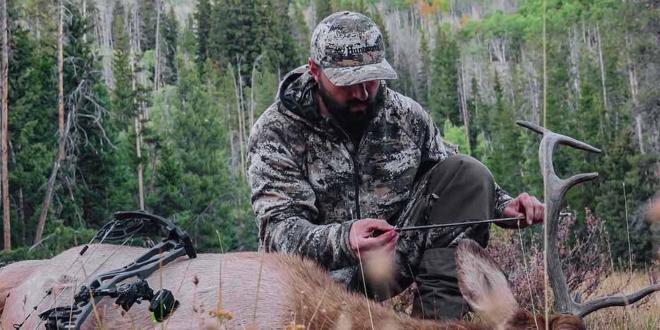 Hunter dressed in full camo suit for Early Season Mule Deer and Elk hunting