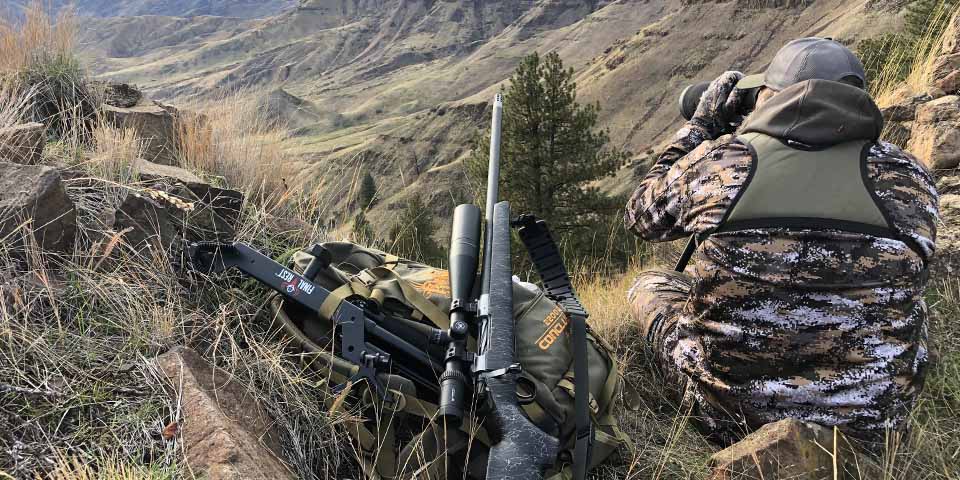 Hunter dressed in full camo suit for Late Season Mule Deer and Elk hunting