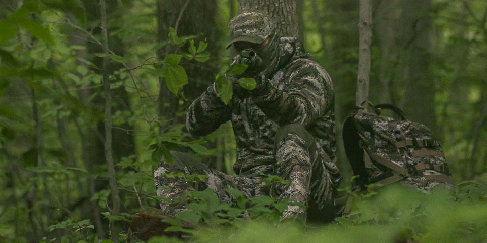 Hunter dressed in full camo clothing for spring Turkey Season hunting